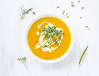 Bowl of carrot pumpkin soup with topping - KNTF000209