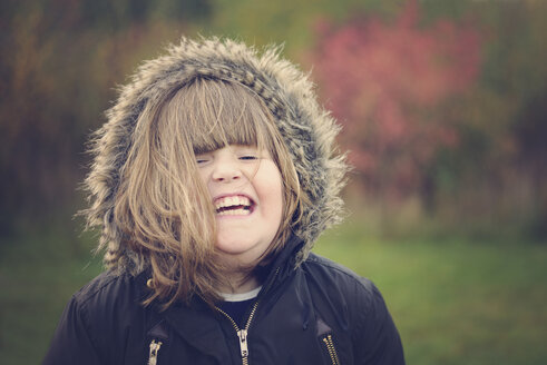 Portrait of girl laughing, winter jacket - MJOF001127