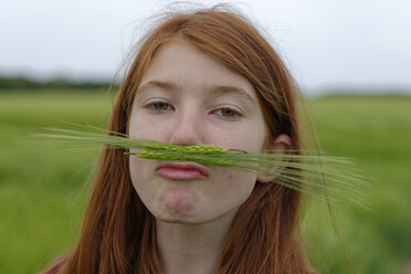 Portrait of teenage girl with barley moustache - LBF001314