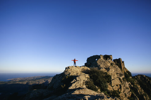 Spain, Catalunya, Girona, female hiker on mountaintop enjoying the nature - EBSF001164