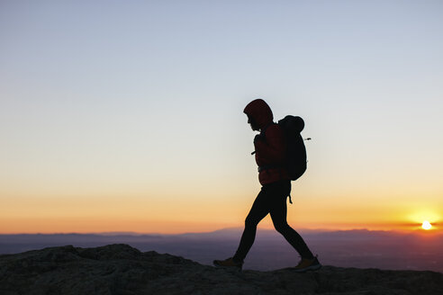 Spain, Catalunya, Girona, woman hiking at sunrise - EBSF001169