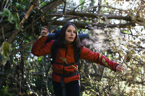 Spain, Catalunya, Girona, female hiker walking in the woods - EBSF001191