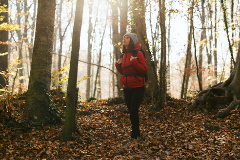 Spain, Catalunya, Girona, female hiker standing in the woods - EBSF001195