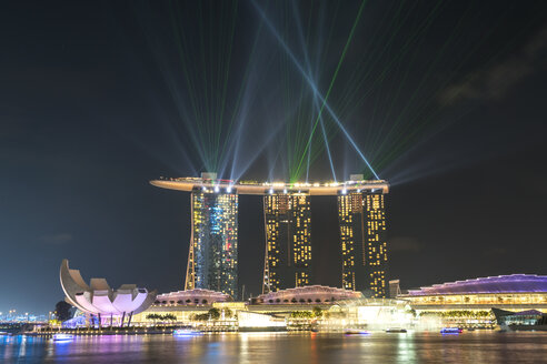 Singapore, view to Marina Bay Sands Hotel with laser show on the sky in the evening - PCF000212