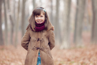 Young girl, brown coat in park, autum, smiling - XCF000046