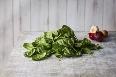 Fresh spinach leaves on wood - KSWF001713