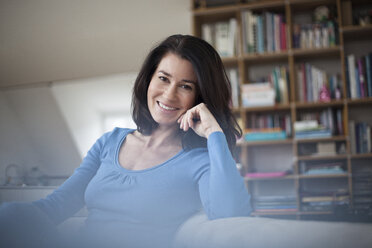 Portrait of smiling relaxed woman at home - RBF003655