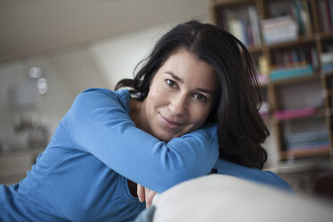 Portrait of smiling relaxed woman at home - RBF003663