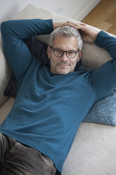 Portrait of mature man at home lying on couch - RBF003705