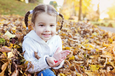 Happy girl in autumn leaves - HAPF000063