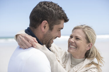 Laughing couple on the beach - ZEF007709