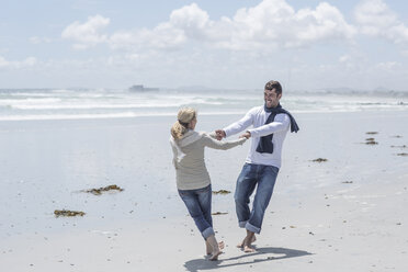 Couple having fun together on a beach - ZEF007716