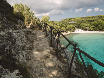 Spain, Menorca, Ciutadella de Menorca, Stone path in Macarella beach - RAEF000754