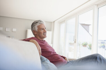 Mature man relaxing on the couch at home - RBF003803