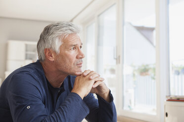 Portrait of pensive man at home - RBF003825