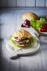 Hamburger with ground beef on chopping board - KSWF001724