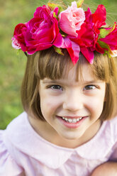 Portrait of smiling little girl wearing flowers - LVF004332