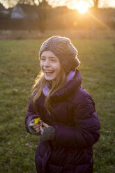 Portrait of laughing girl in autumn at evening twilight - SARF002423