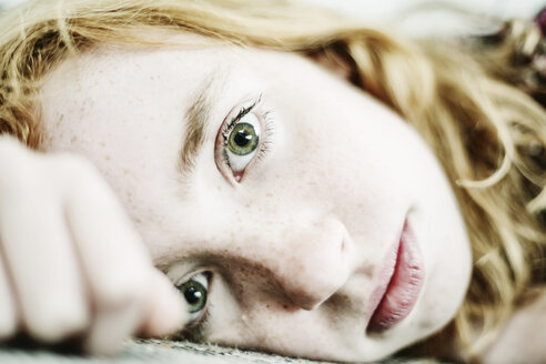 Portrait of girl with freckles and green eyes - JATF000811