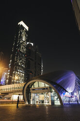 UAE, Dubai, view to entrance of lighted tube station by night - MAUF000210