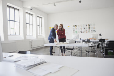 Two architects discussing project in office - RBF003979