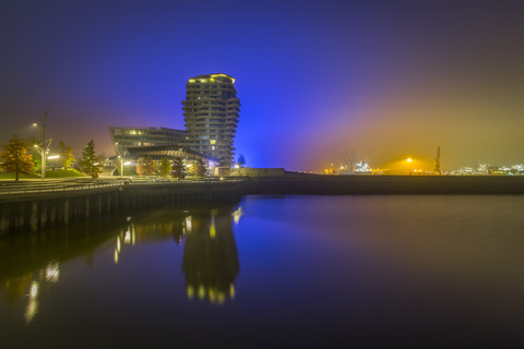 Germany, Hamburg, Marco Polo Tower and Marco Polo Terraces illuminated at night stock photo