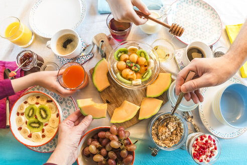 Breakfast, laid table, fresh muesli, hands taking - SARF002426