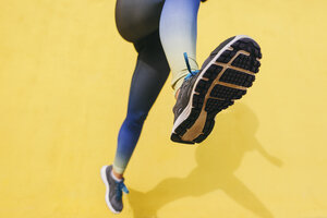 Spain, Barcelona, jogging woman, sole of shoe - EBSF001228