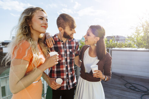 Austria, Vienna, Young people having a party on rooftop terrace - AIF000234