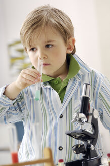 Portrait of little boy with test tube and microscope - GUFF000242