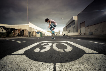 Spain, Tenerife, boy skating on a road - SIPF000049