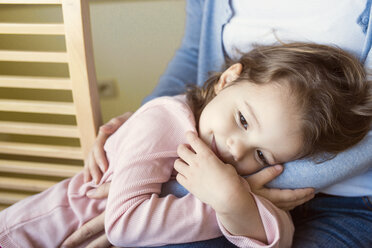 Portrait of smiling little girl cuddling with her mother - HAPF000124