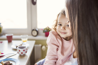 Portrait of smiling little girl cuddling with her mother - HAPF000131