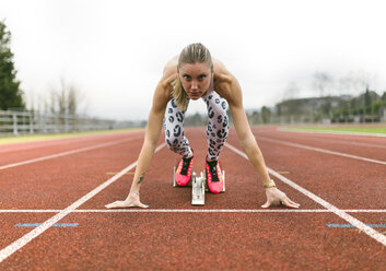 Athlete woman on a running track - MGOF001261