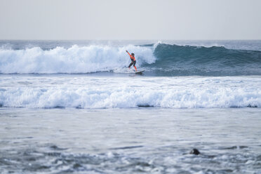 Spain, Tenerife, Boy surfing on ocean - SIPF000059