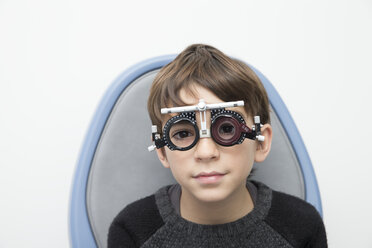 Boy wearing eye test equipment - ERLF000100