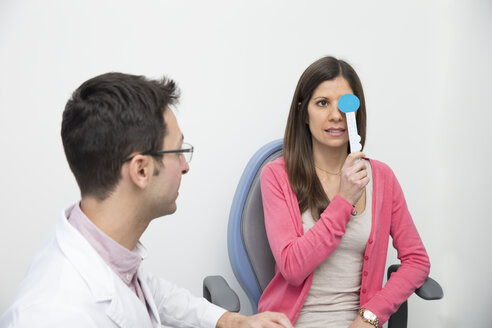 Woman at the optometrist making an eye test - ERLF000110