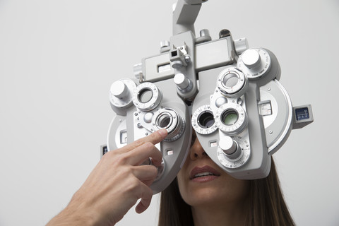 Woman at the optometrist making an eye test stock photo