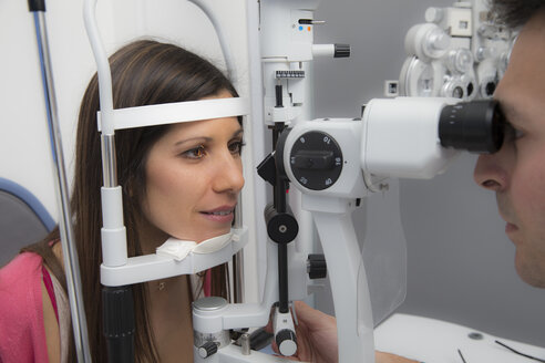 Woman at the optometrist making an eye test - ERLF000116
