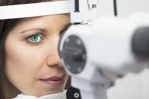 Woman at the optometrist making an eye test - ERLF000119