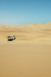 Namibia, Namib desert, Swakopmund, 4x4 car driving among the dunes in the desert - GEMF000638