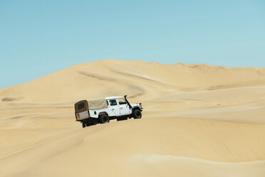 Namibia, Namib desert, Swakopmund, 4x4 car driving among the dunes in the desert - GEMF000639