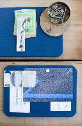 DIY mood board made from cork mats with ticket, screws and nails - GISF000196