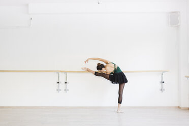 Dancer practicing at the barre in the gym - MRAF000011