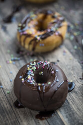 Chocolate doughnut with hundreds and thousands - SARF002485