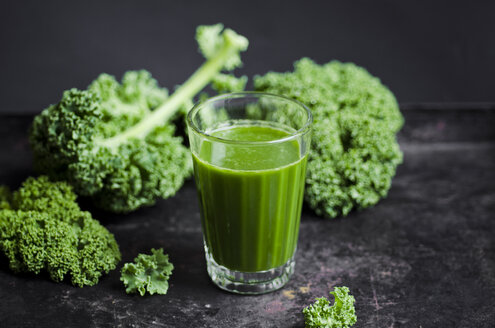 Glass of kale smoothie with different fruits - CZF000241