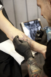 Tattooist at work - MFRF000492