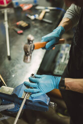 Young mechanic working on bench vice, close up - RAEF000795