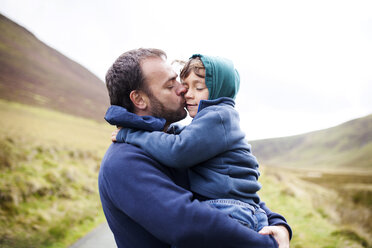 UK, Bala, father and son hugging each other - VABF000088