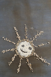 Different grains building a smiling sun - MYF001330